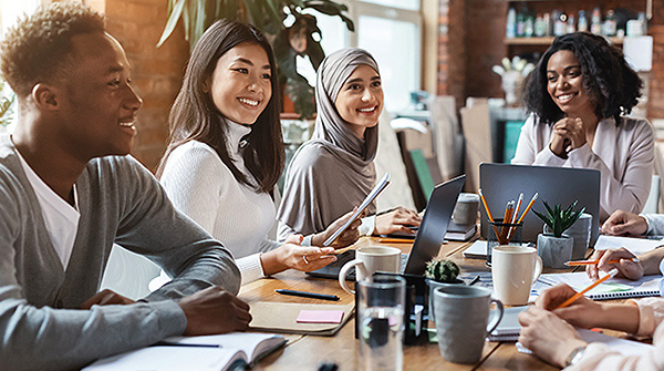 Young professionals meet around a table