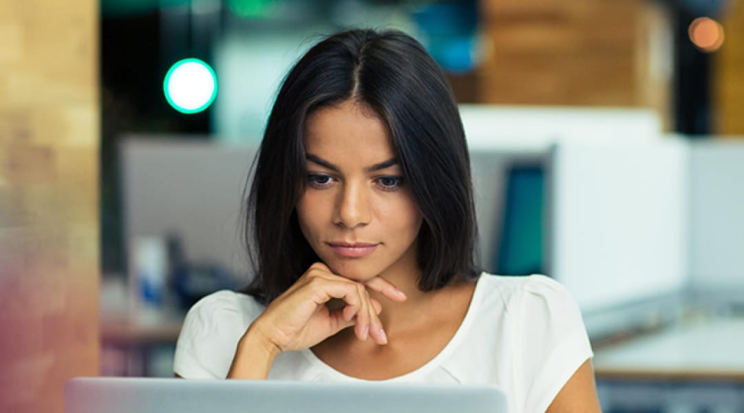 Woman viewing laptop
