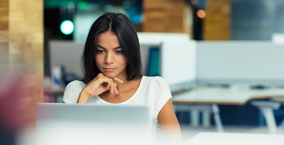 Woman looking at laptop