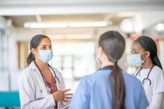 Doctor speaking with nurse