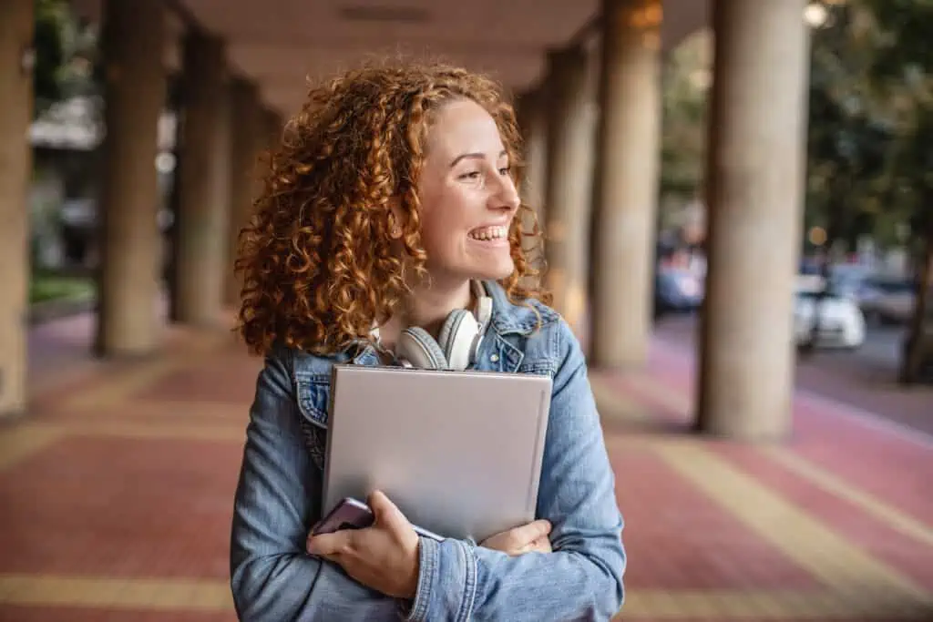 A young student smiling after taking WES credential evaluation